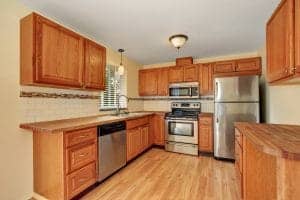 Wooden kitchen interior with custom cabinetry